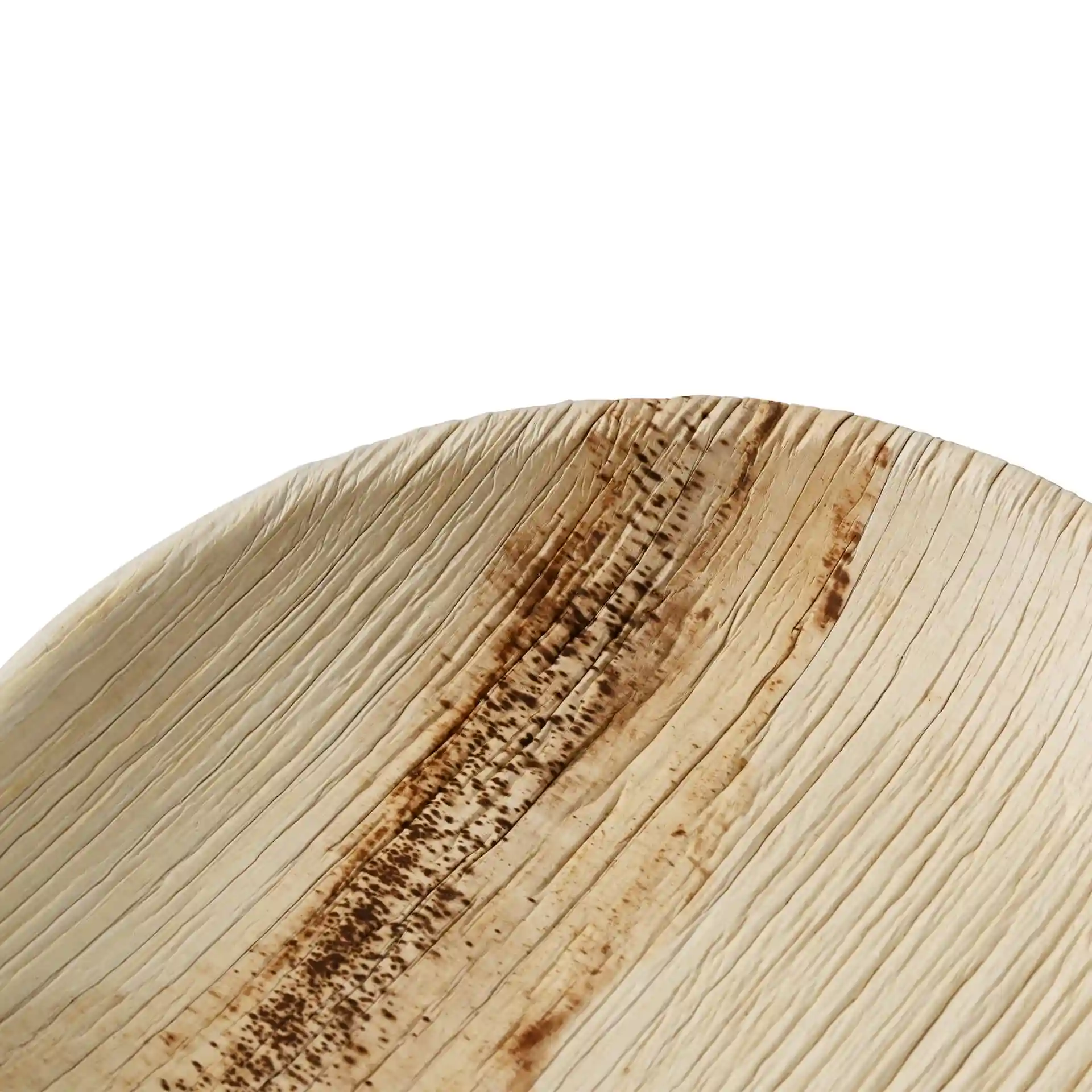 Assiette ronde en feuille de palmier avec surface texturée et motif de grain naturel, mesurant 15 cm de diamètre.