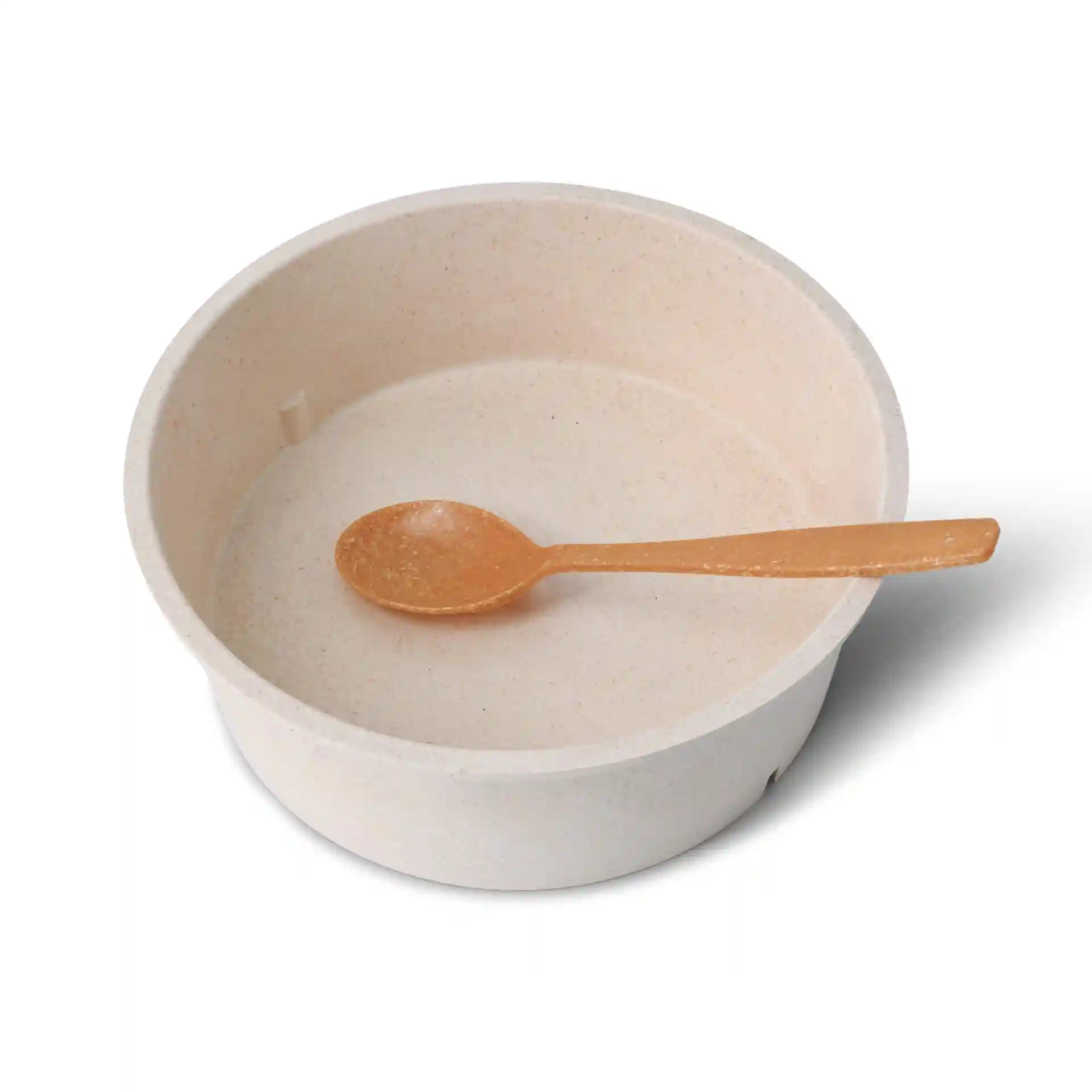Bol rond crème réutilisable avec une petite cuillère orange à l'intérieur, fabriqué en matériau composite bio.