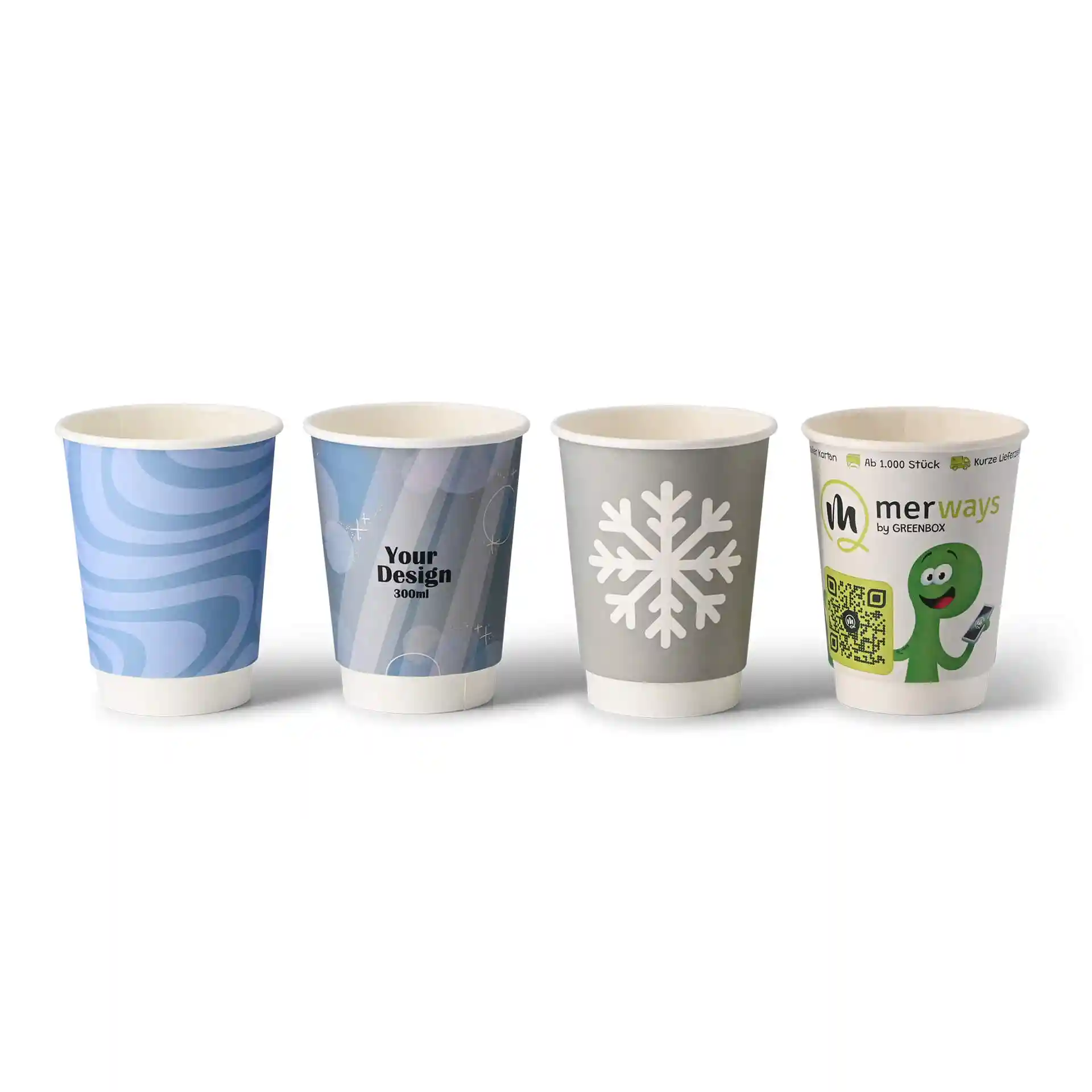 Quatre gobelets en papier à double paroi avec divers motifs : tourbillons bleus, un flocon de neige et un personnage vert, le tout sur fond blanc.