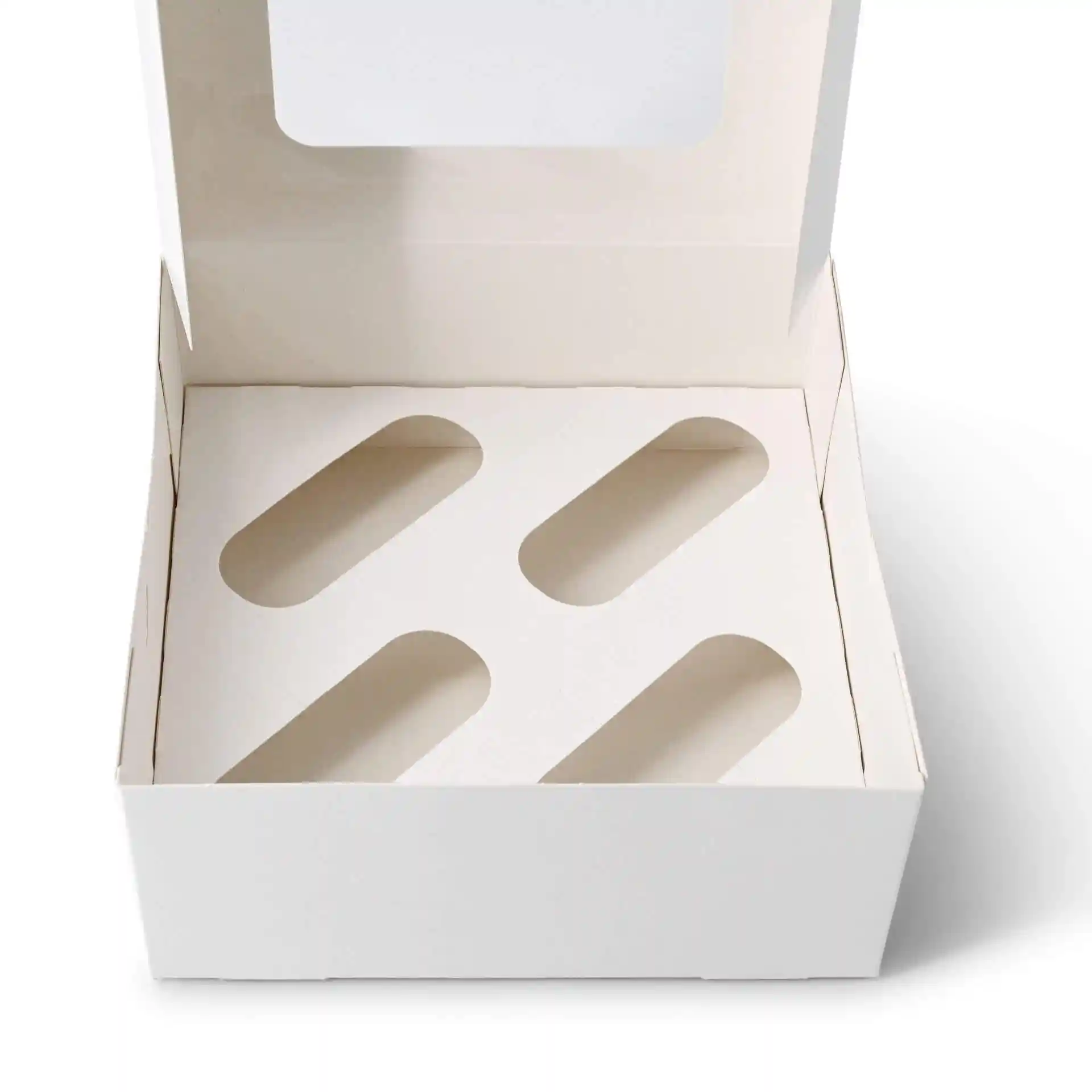 Insert en carton blanc pour boîtes à cupcakes avec quatre découpes ovales.