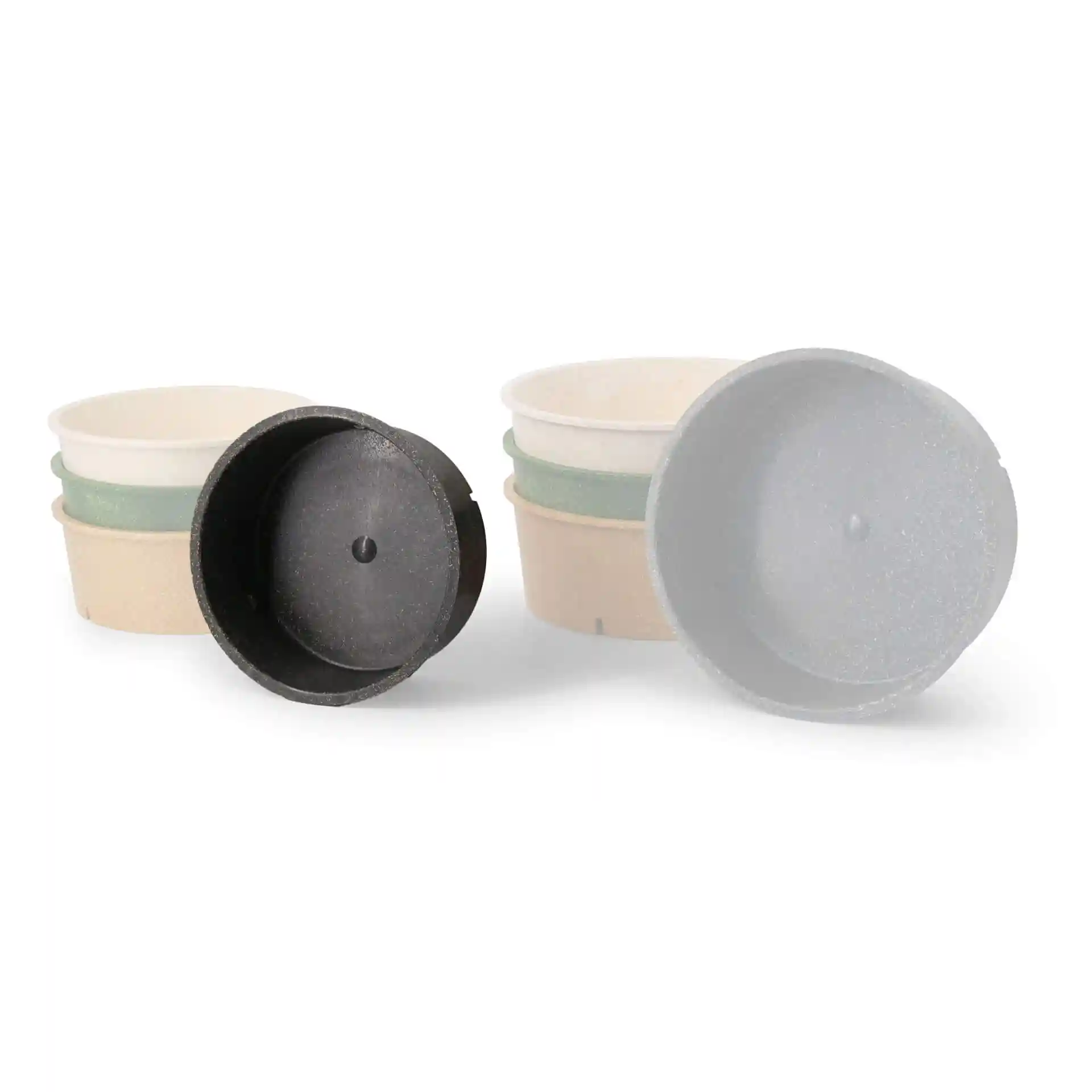 Image de plusieurs bols ronds réutilisables en gris et couleur poivre, avec un bol montré à l'envers.