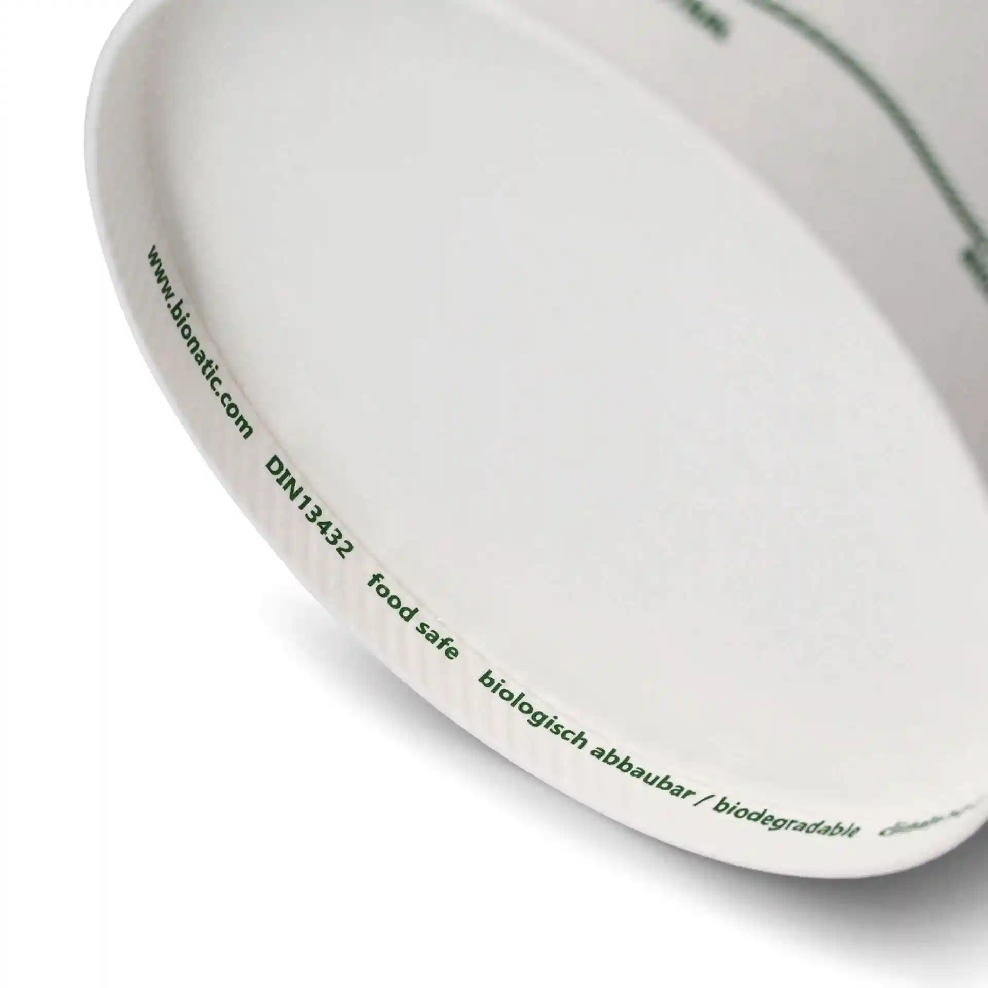 Contenant rond en carton pour soupe avec marquages imprimés, montrant le bord intérieur et une partie de l'extérieur.