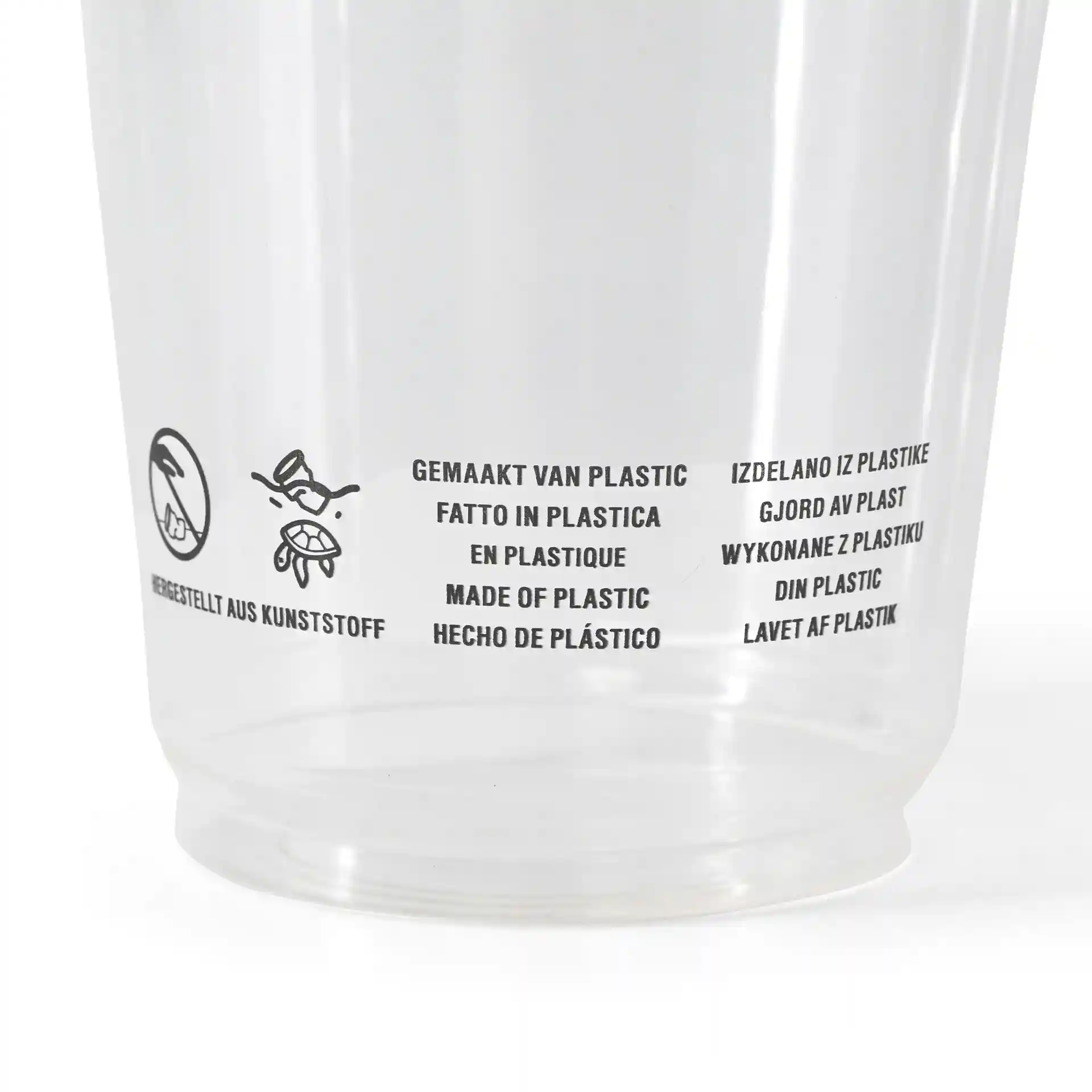 Gobelet en plastique transparent avec texte multilingue imprimé sur le matériau et les instructions d'utilisation.