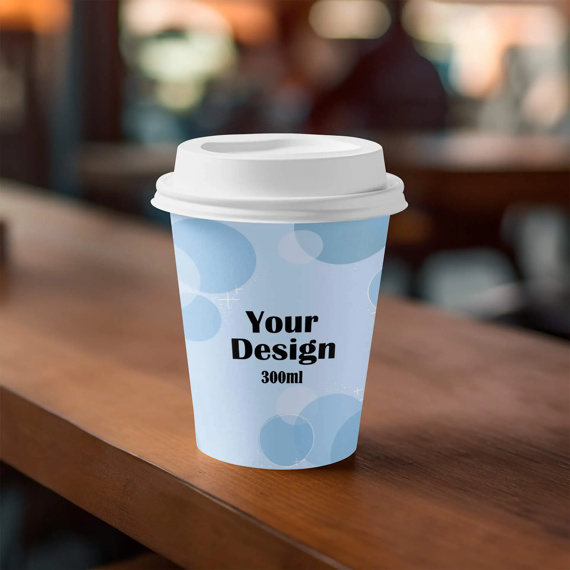 Gobelet en papier simple paroi avec un design bleu, portant le texte « Votre design » et une capacité de 300 ml sur une surface en bois.