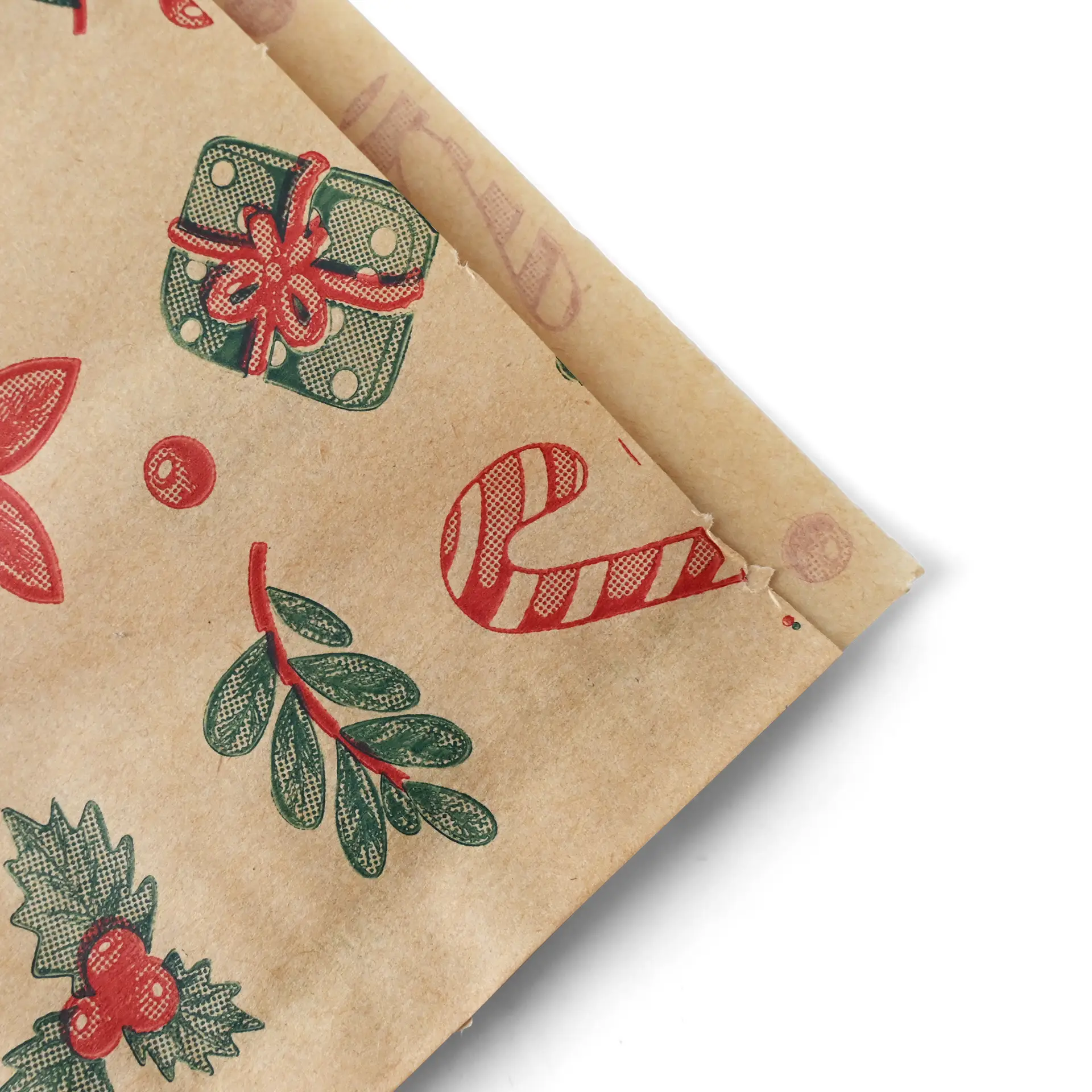 Sac en papier brun résistant à la graisse avec un design d'hiver présentant des cannes en sucre, des cadeaux et du feuillage. Mesure 19 x 19 cm.