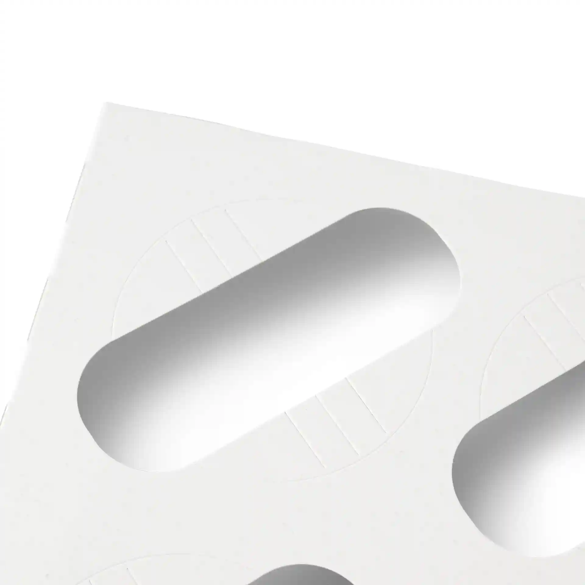 Insert en carton blanc avec découpes ovales pour maintenir des cupcakes, conçu pour être utilisé dans des boîtes à cupcakes.