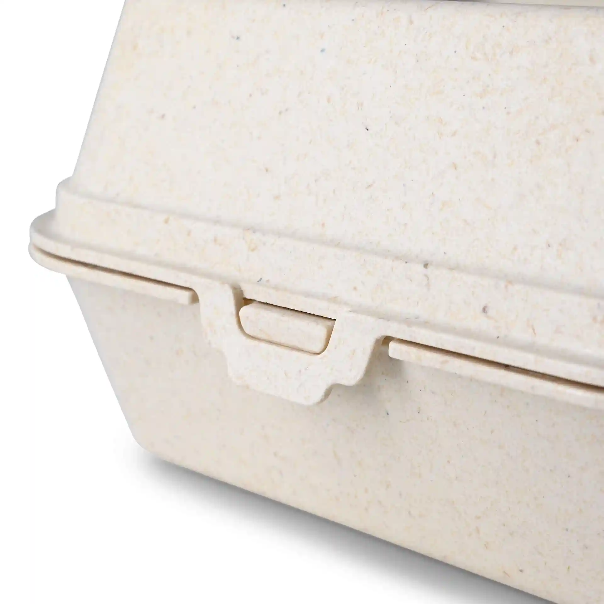 Gros plan sur une boîte à burger réutilisable crème blanche en composé bio, montrant le couvercle et les détails de fermeture.
