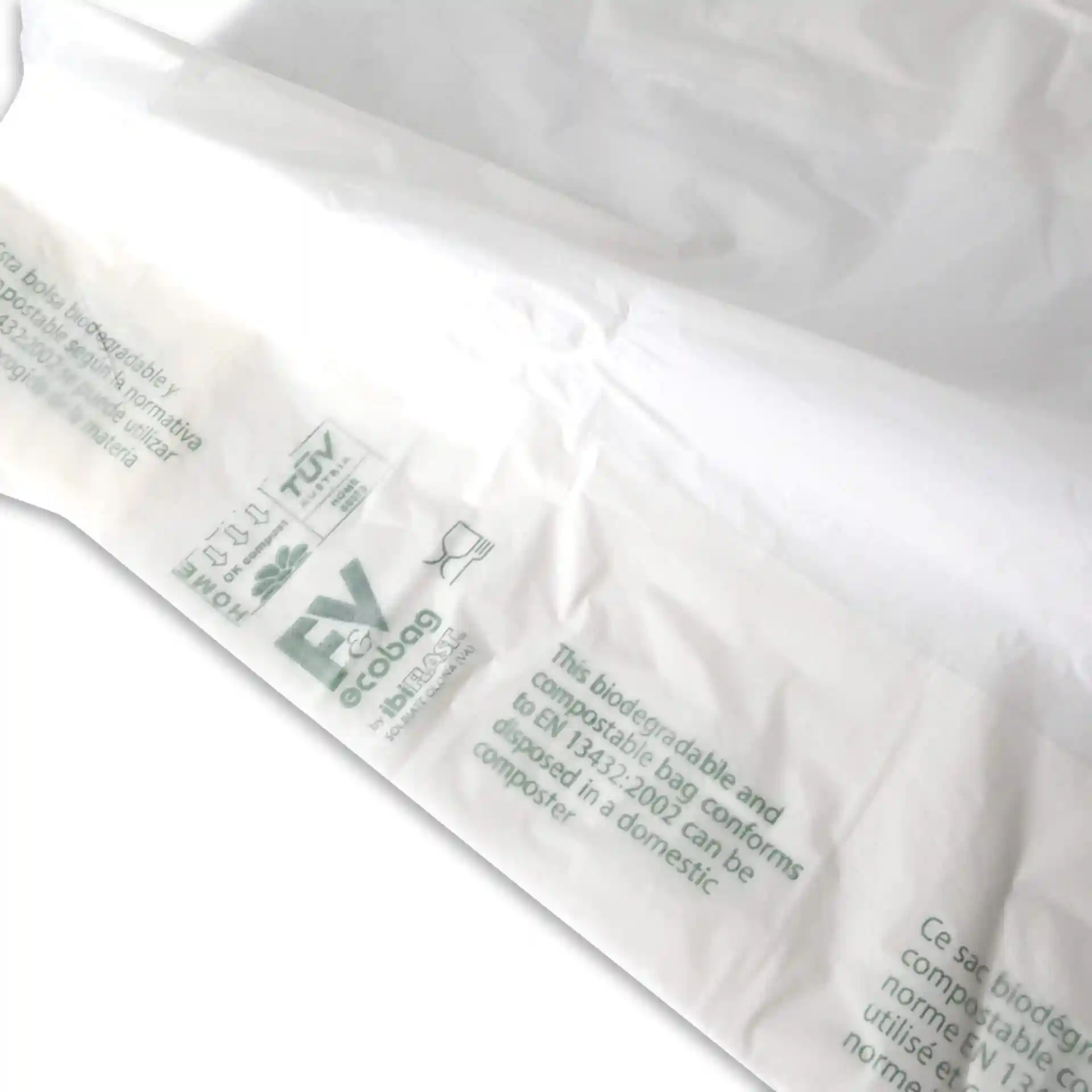 Sac biodégradable blanc avec marquages imprimés, mesurant 22 x 13 x 50 cm, montré partiellement ouvert.
