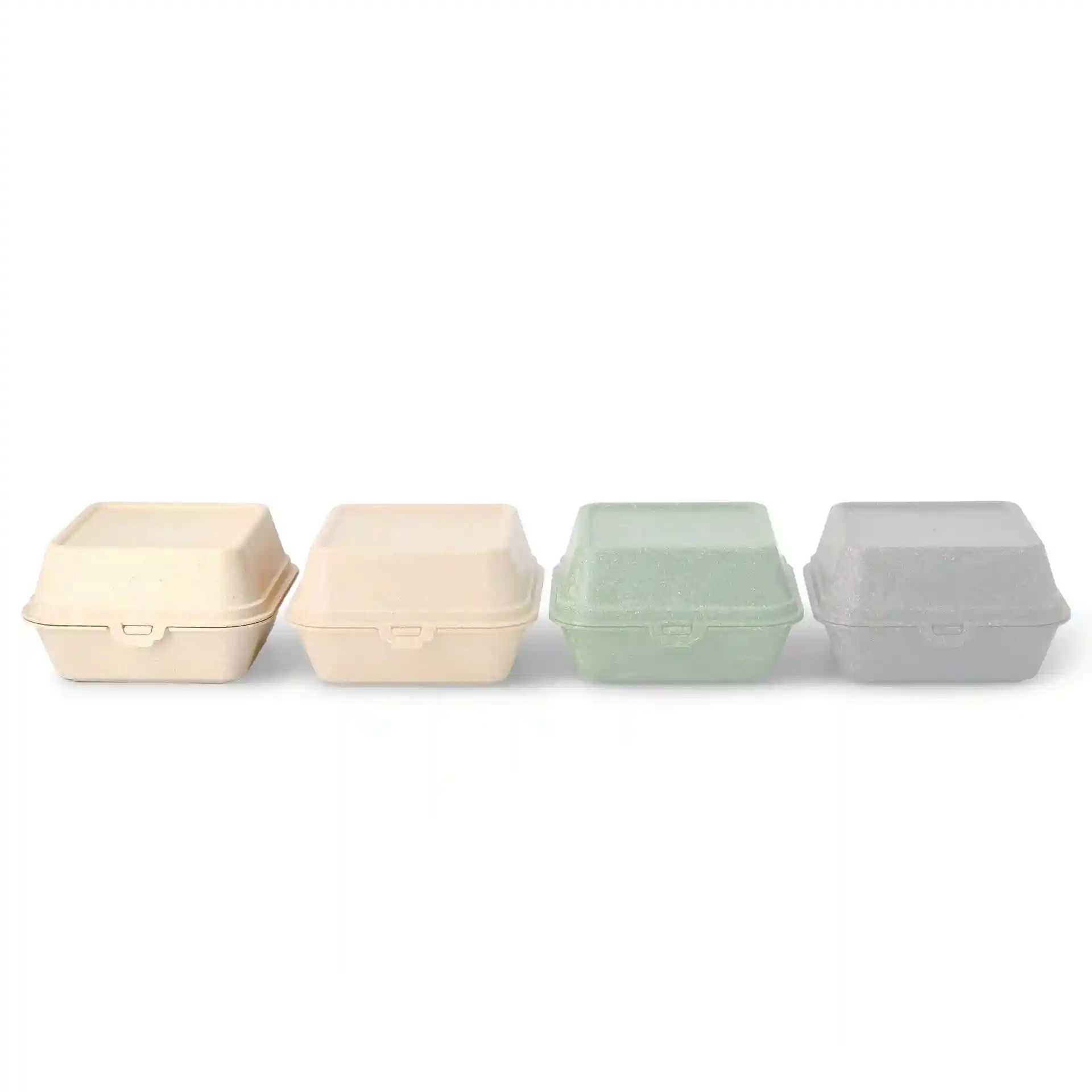 Quatre boîtes à burger réutilisables en blanc crème, vert et gris, empilées côte à côte sur un fond uni.