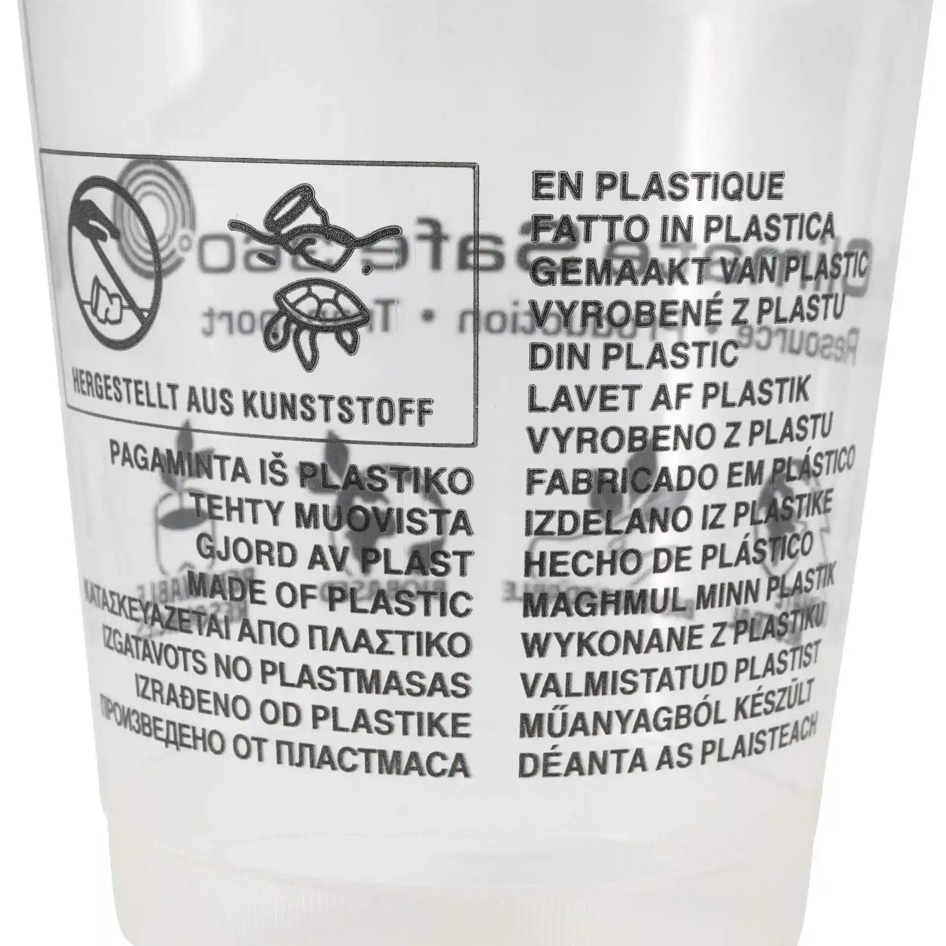 Gobelet transparent avec texte multilingue imprimé sur le matériau plastique et les instructions d'utilisation.