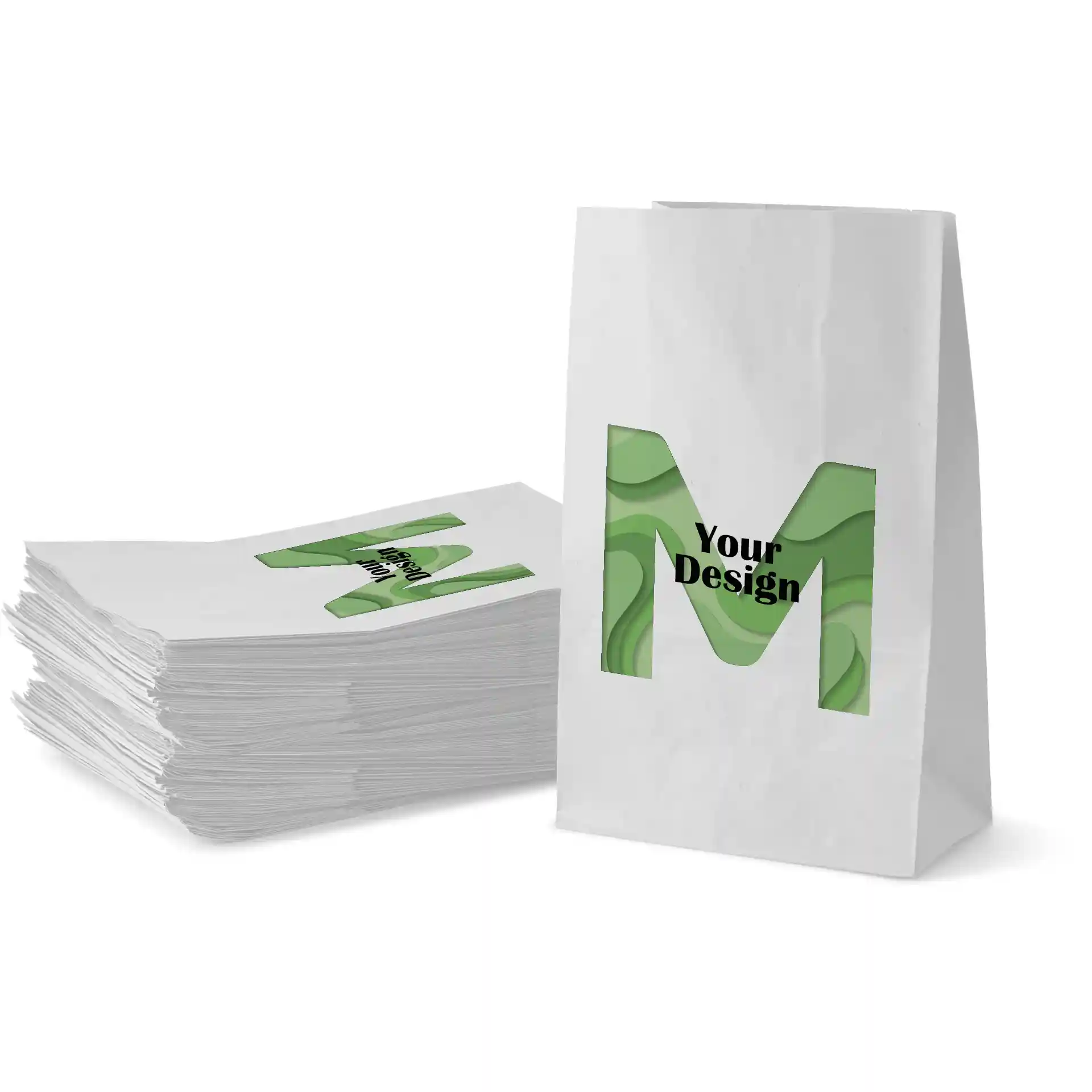 Sac en papier blanc imprimé avec un design vert présentant la lettre 'M' et le texte 'Votre Design', empilé avec des sacs similaires.